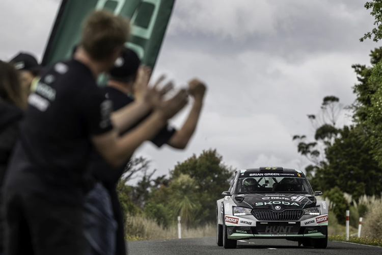 A crowd cheers for Ben Hunt’s Škoda Fabia R5 rally car