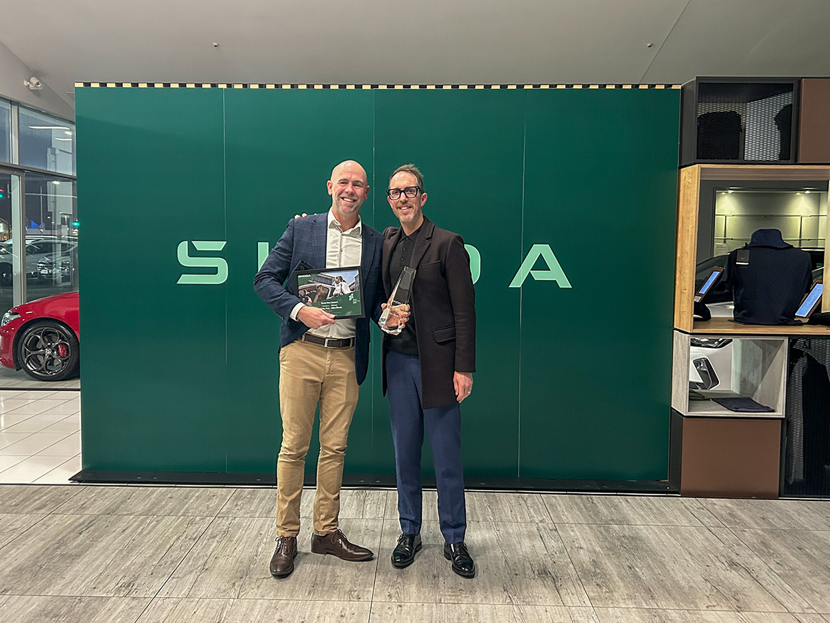 Miles Skoda receiving Dealer of the year