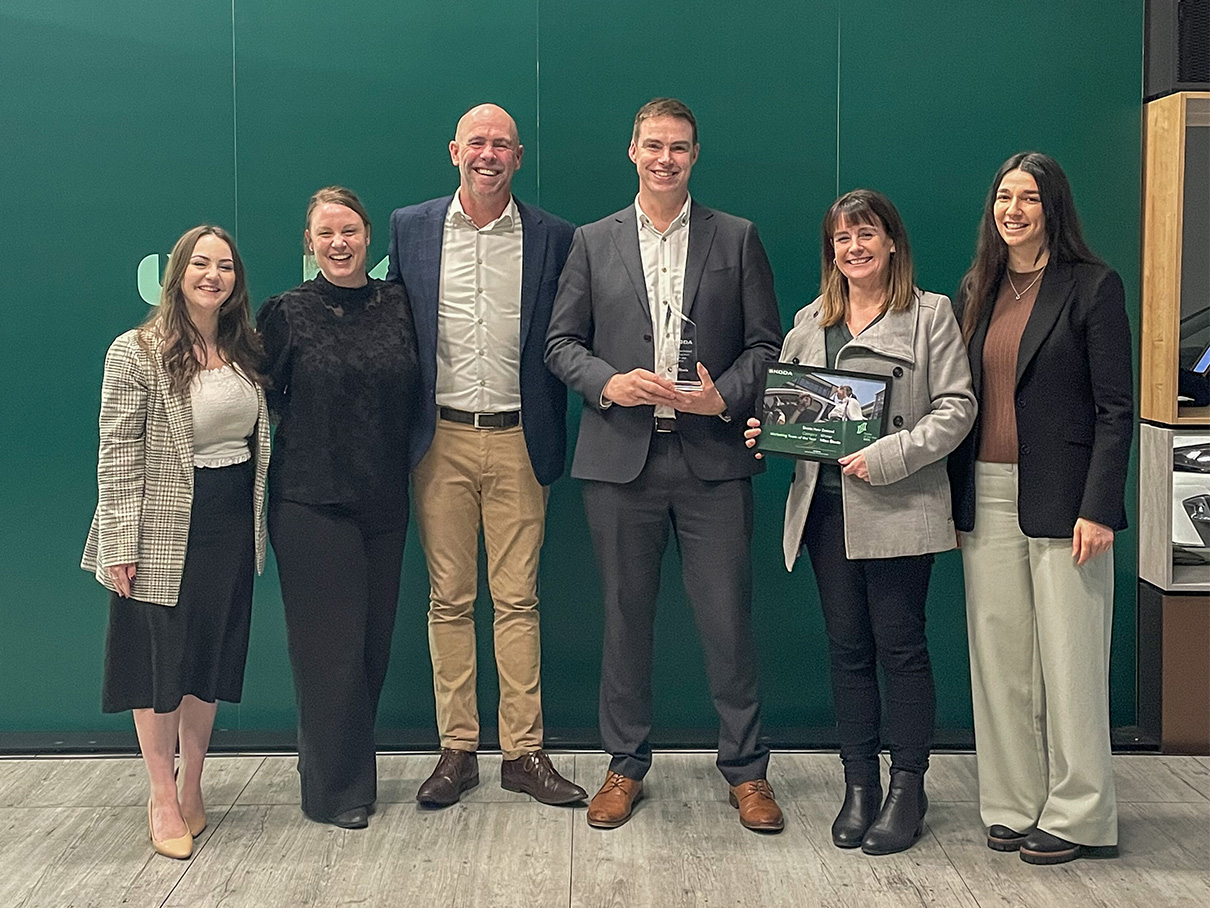 Miles Skoda receiving Marketing team of the year