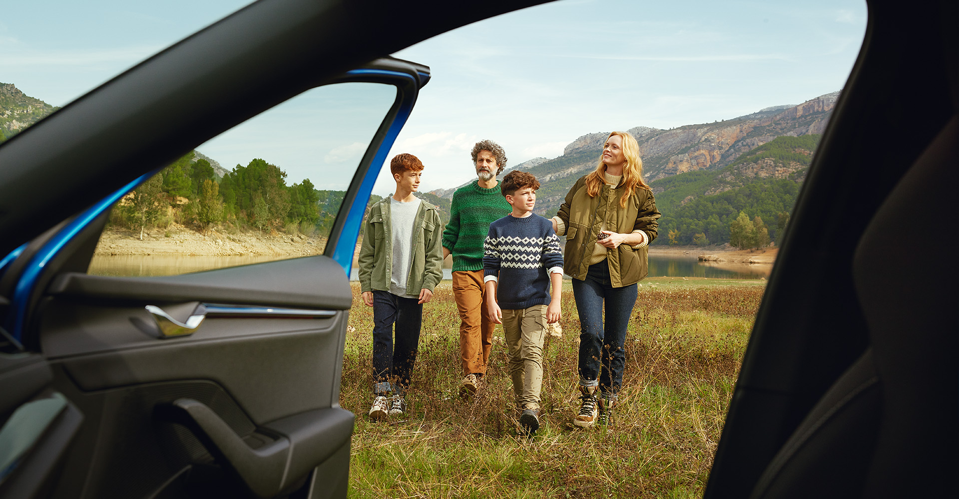 Family walking by Skoda Octavia